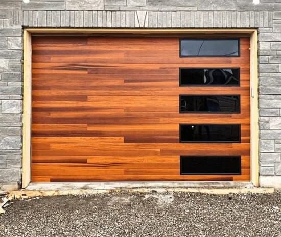 Wood-look garage door with a vertical row of windows on one side